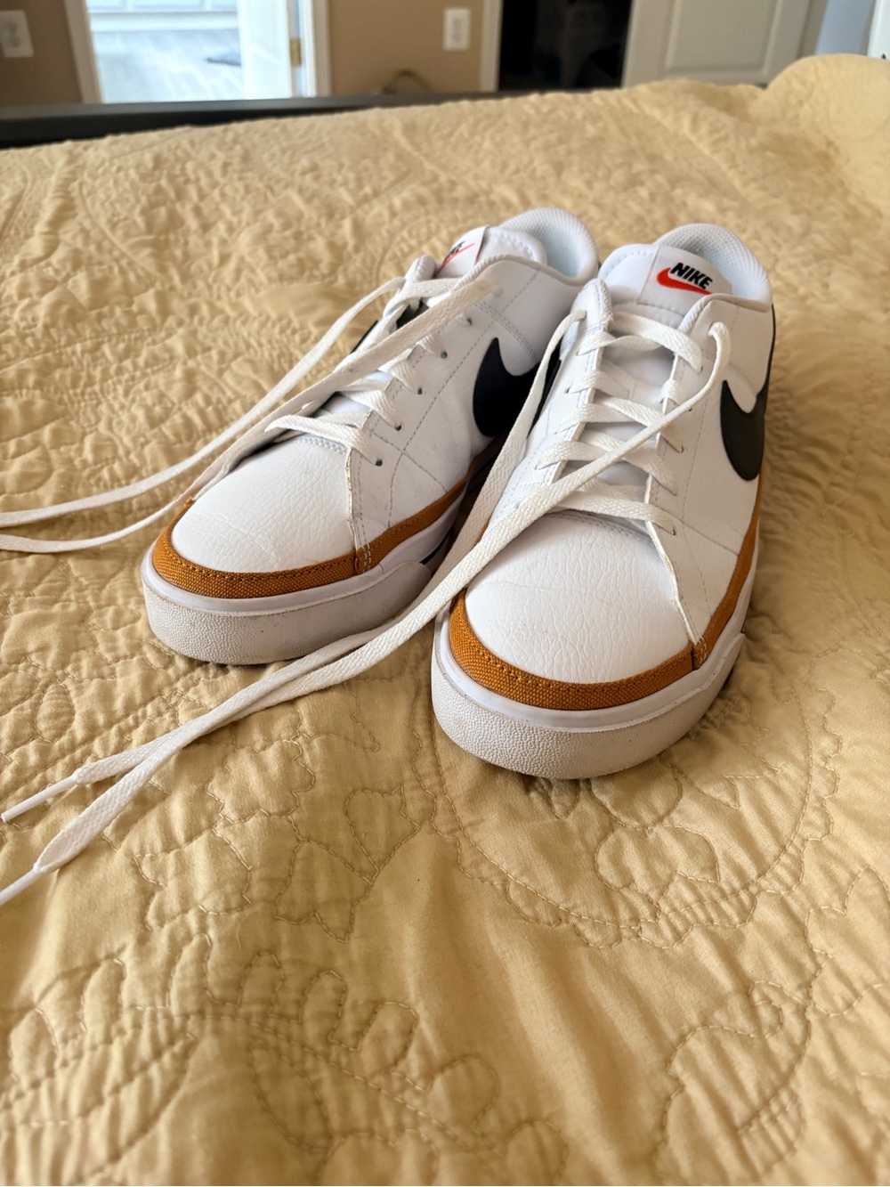 Nike Women’s White Sneakers with Black Swoosh and Brown Accent